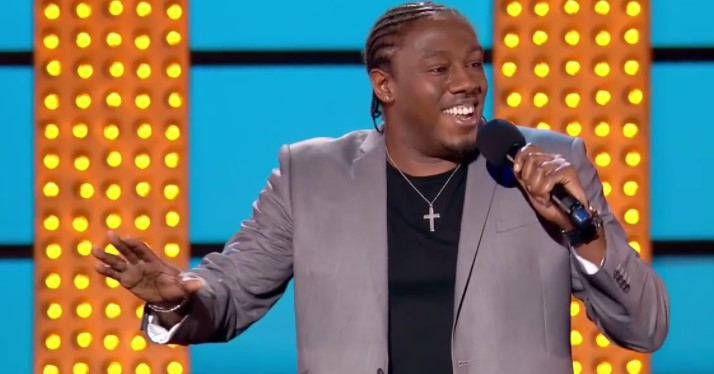 Stand up comedian Nathan Caton performs onstage in central London