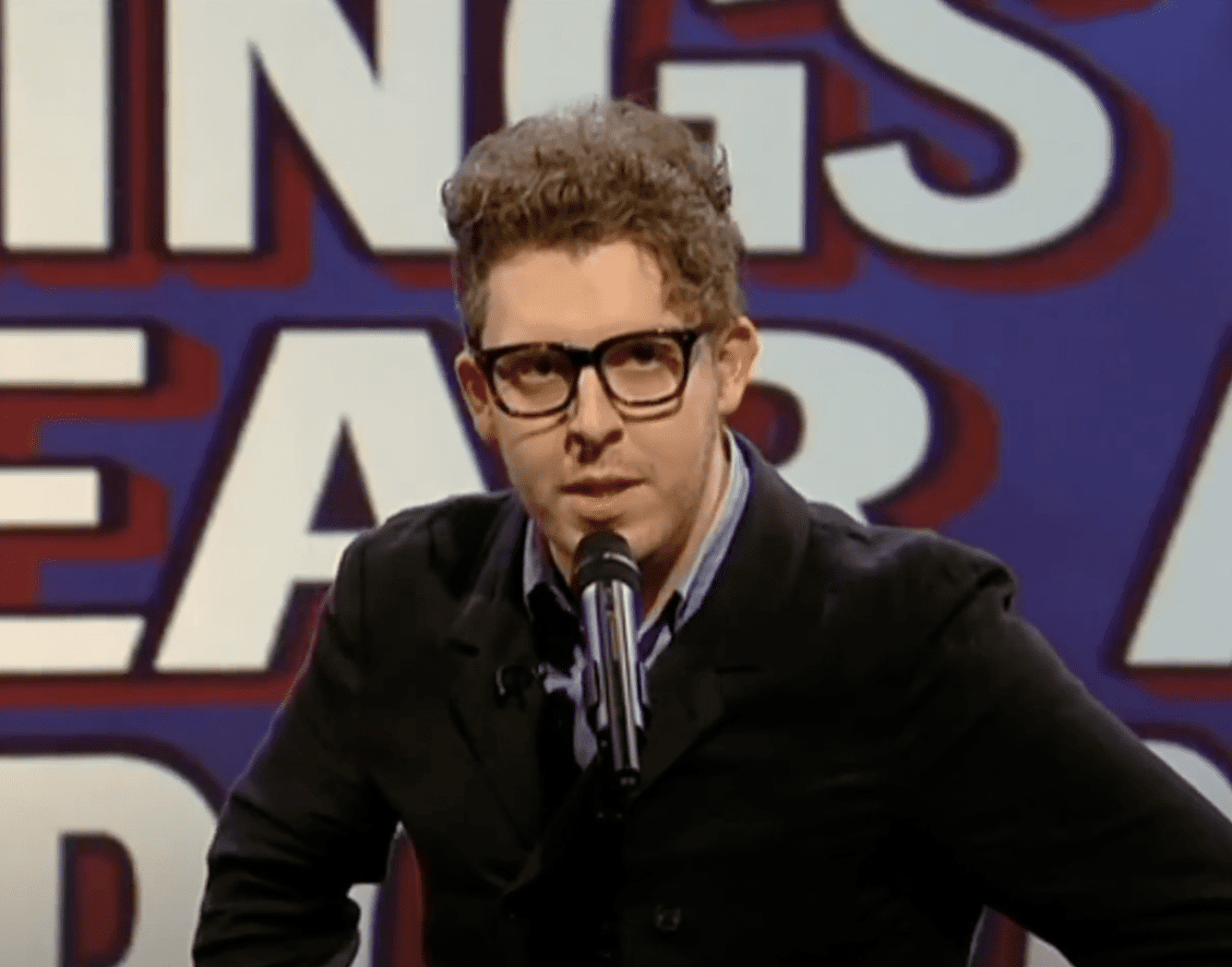 Carl Donnelly performs comedy at 99 Club Leicester Square