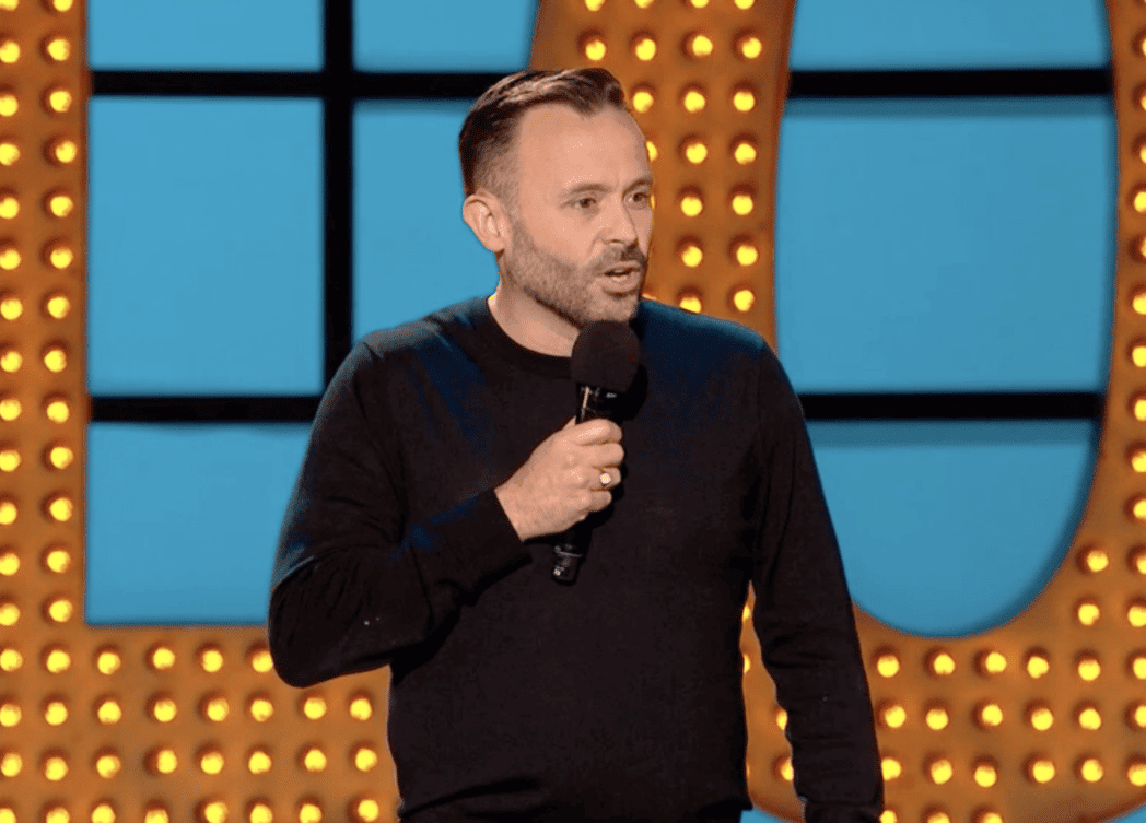 Geoff Norcott performs stand up comedy in a Central London comedy club